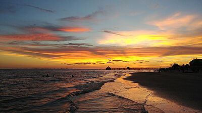 sunset on fort myers beach and pier